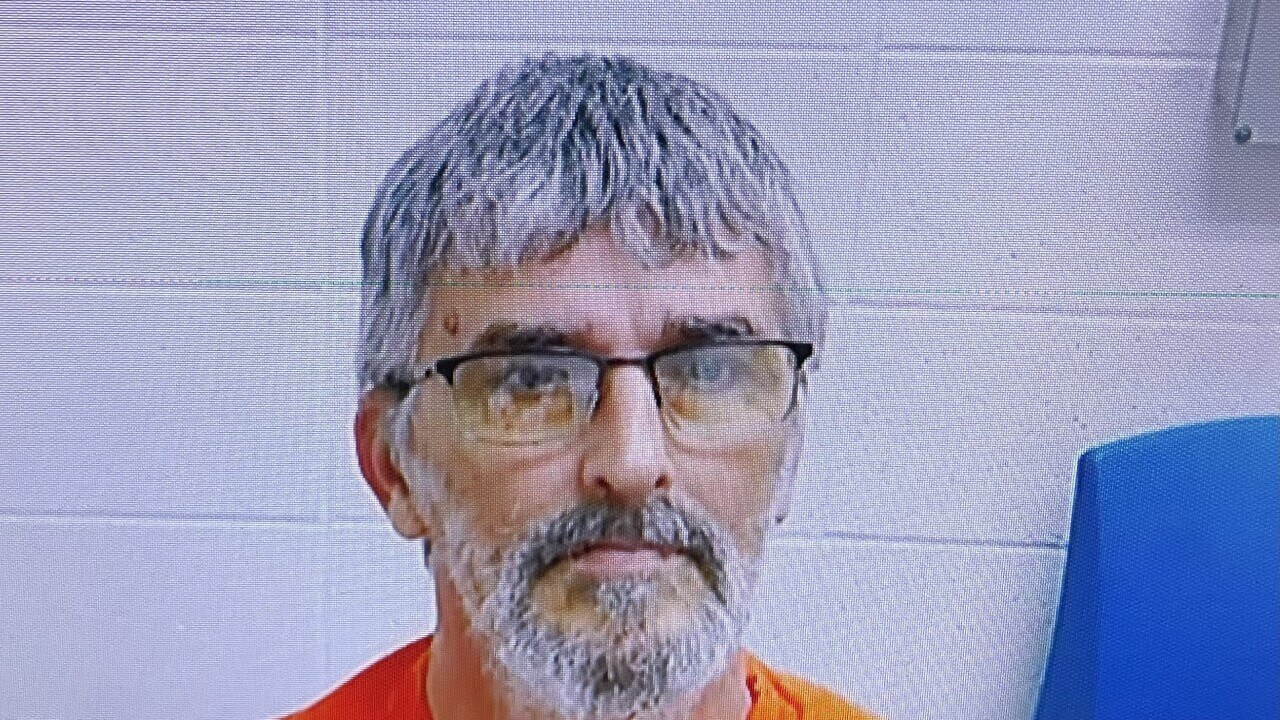 Steven Lawson appears on a computer screen in court