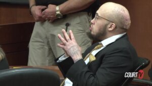 Brice Rhodes sits in court