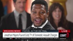 Photo of smiling Jonathan Majors