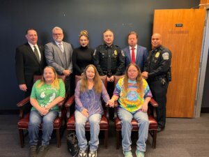 officers and survivors pose for photo