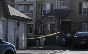 Police tape marks a crime scene where Colorado Springs police found children dead inside a condo