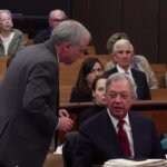 Prosecutor Creighton Waters leans toward defense attorney Dick Harpootlian