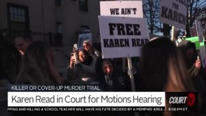 protesters hold signs outside of courthouse