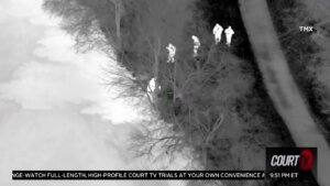 Aerial night vision footage of suspect who jumped in a lake.