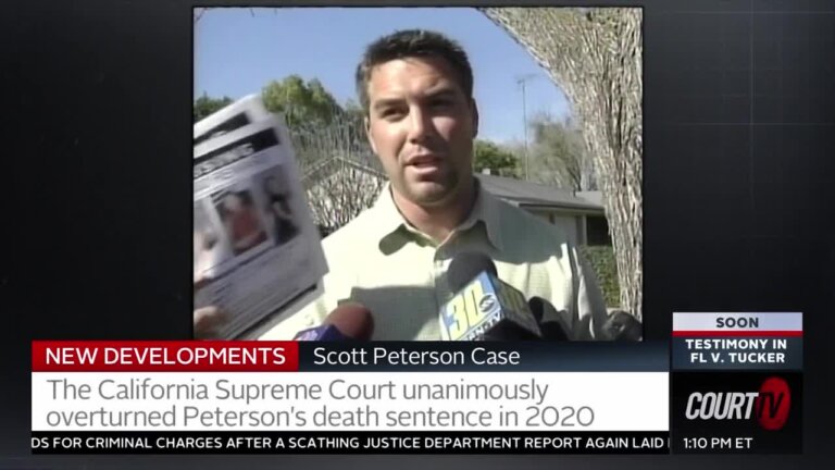 Scott Peterson holds up Laci Peterson fliers.