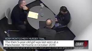 Three people sit at a table in surveillance video