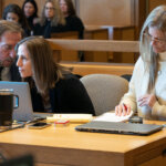 Michelle Troconis sits at defense table