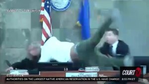 man leaping over judicial bench