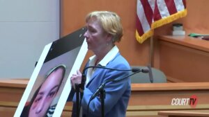 attorney holds up photo of kayla montgomery