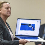 Kari Morrissey shows defense attorney Jason Bowles a picture of a firearm