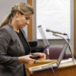 A woman addresses the court