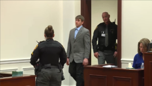 Chad Doerman walks into court in a suit