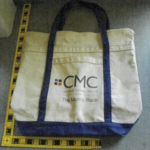 A blue and white tote bag from Catholic Medical Center