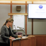 A woman addresses the court