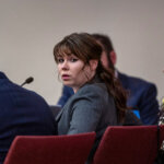 Hannah Gutierrez, center, sits with her attorney Jason Bowles, left,