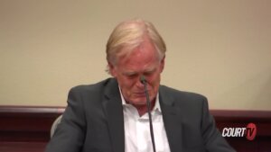 David Halls cries while testifying