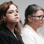 Jennifer Crumbley and her attorney stand in court