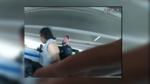 still from bodyworn camera video shows a man being arrested.