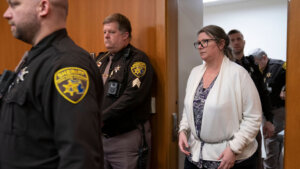 Jennifer Crumbley walks into court in shackles.