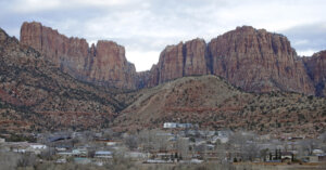 Hildale, Utah, is pictured sitting at the base of Red Rock Cliff mountains