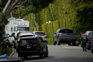 A federal investigator walks on a street