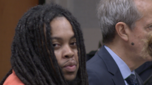 Cola Beale looking at camera in courtroom