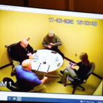 In a frame grab from video, Investigators meet with James Crumbley