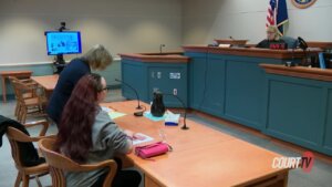 judge and two women in courtroom