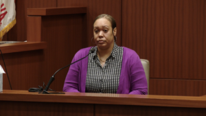 Dina Kareem sits on the witness stand