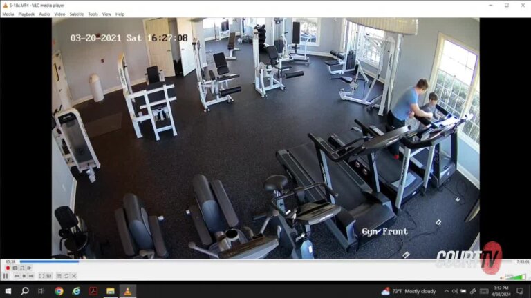 surveillance video shows inside of a gym with boy on treadmill