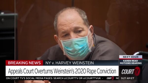 harvey Weinstein sits in a mask in court