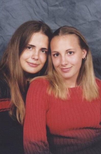 Two women smile in a photograph