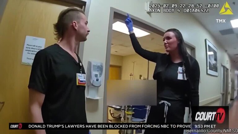 Hospital employee points at ceiling.