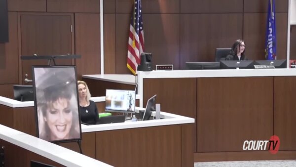 judge jennifer dorow delivers a sentence with photo of victim in foreground