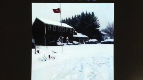 photo of a house covered in snow