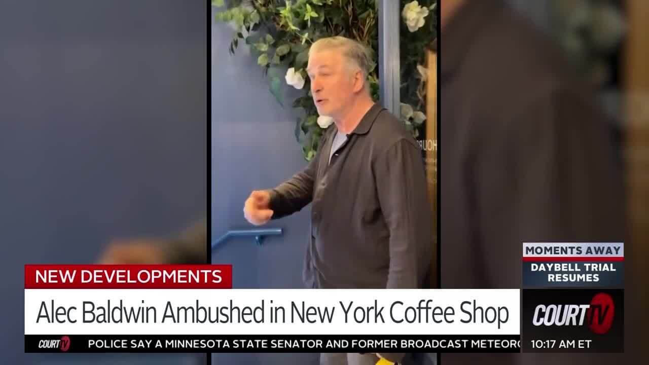 Alec Baldwin holds a door open in a still from video