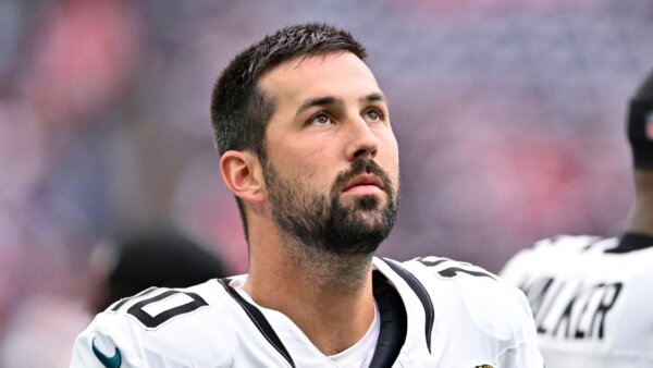 Brandon McManus stands on the sideline