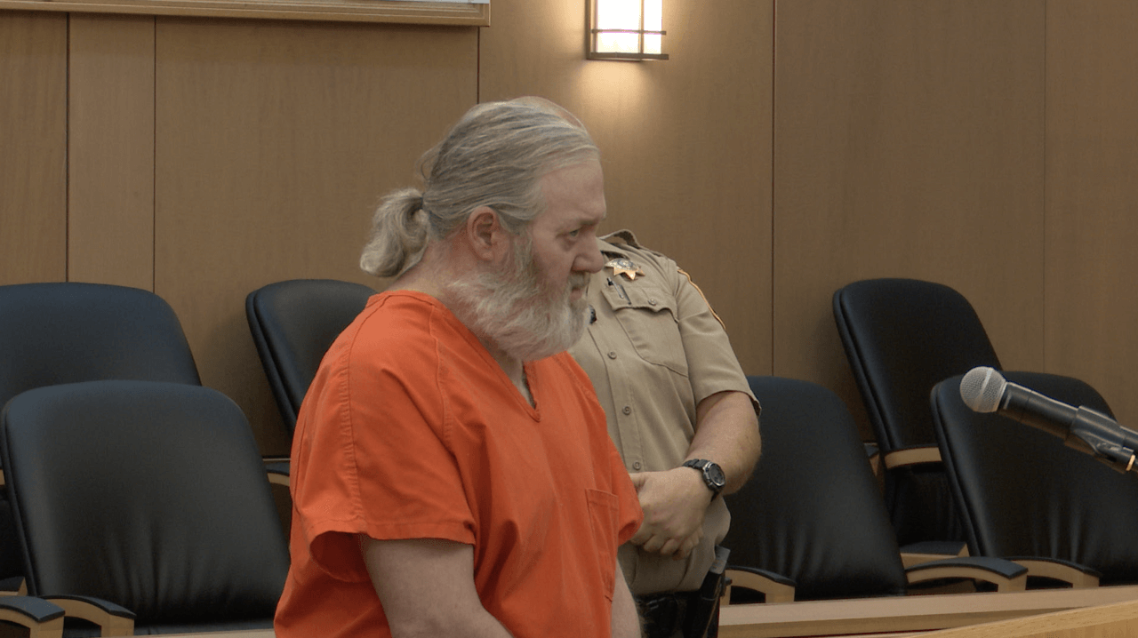 James Brenner stands in court