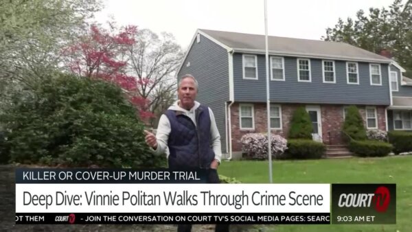 vinnie politan stands in front of house