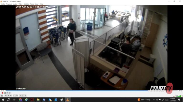 surveillance video shows Chris Gregor holding his son in the hospital