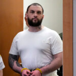 Adam Montgomery enters sentencing.