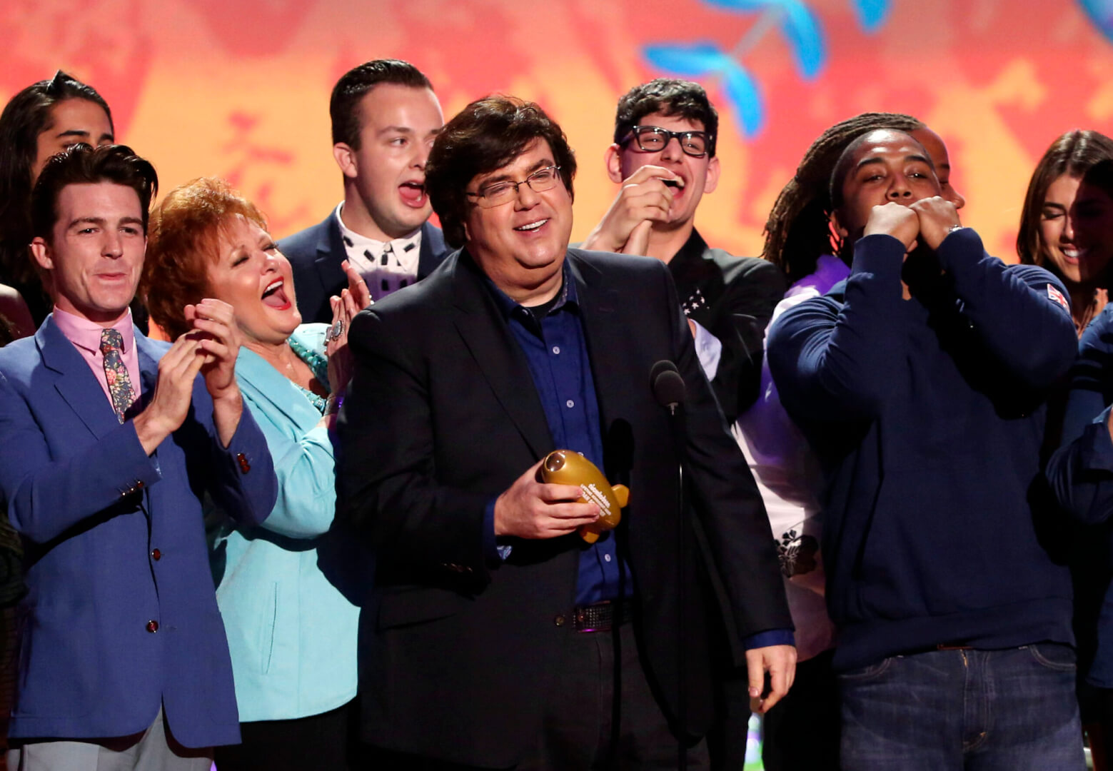 File of Dan Schneider and other Nockelodeon staffers accepting an award.