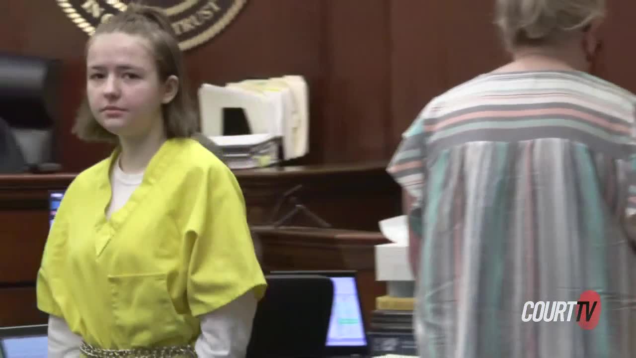 Carly Gregg walks through court during a hearing
