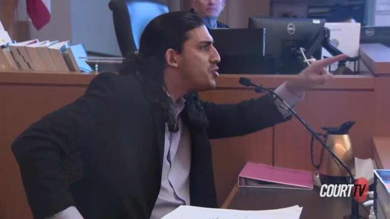 Ali Abulaban points at the prosecutor