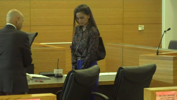 Ashley Benefield stands in court