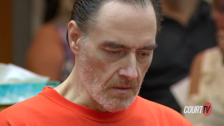 Closeup of Man in orange jumpsuit