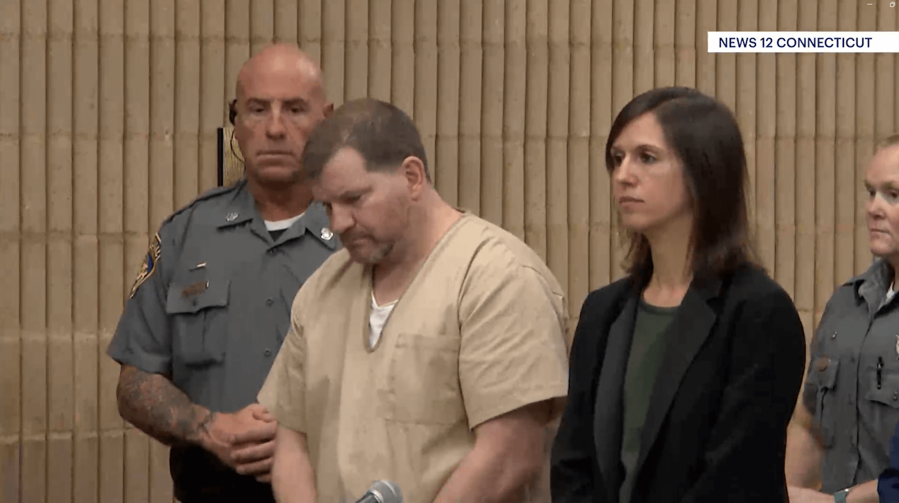 Ewen Dewitt stands in court