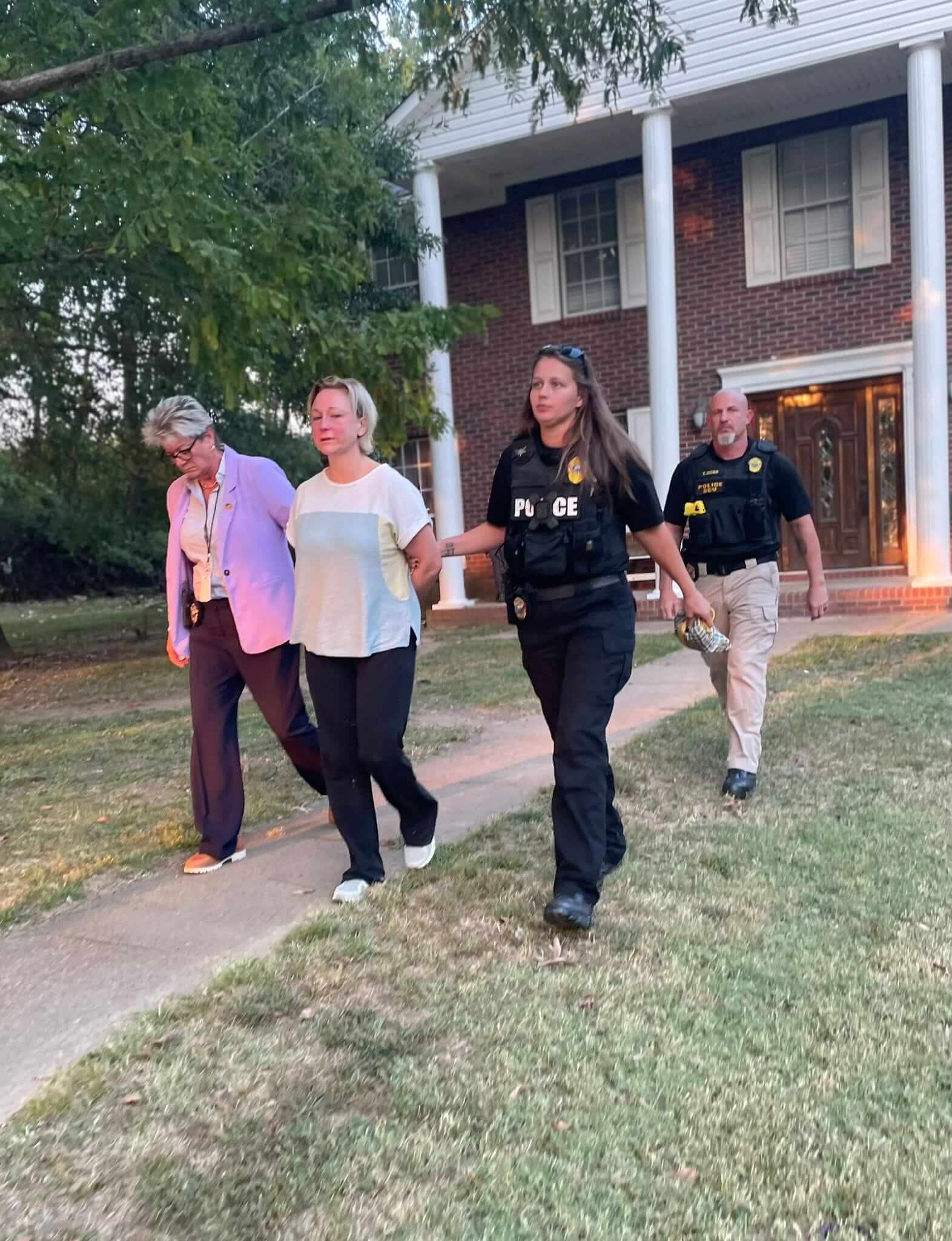 Alissa McCommon walks in handcuffs