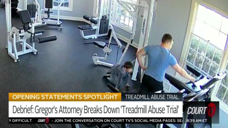 Man standing over child on treadmill