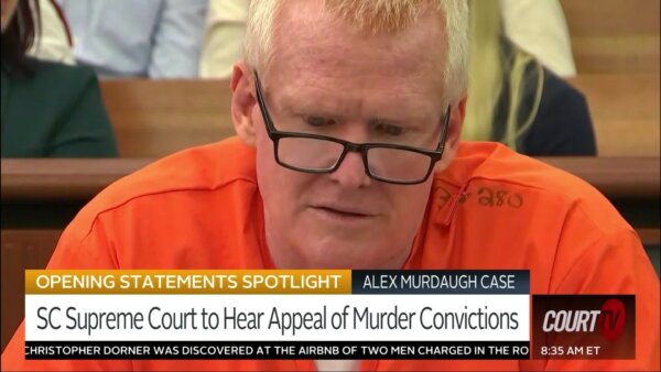 Man in court with orange jumpsuit